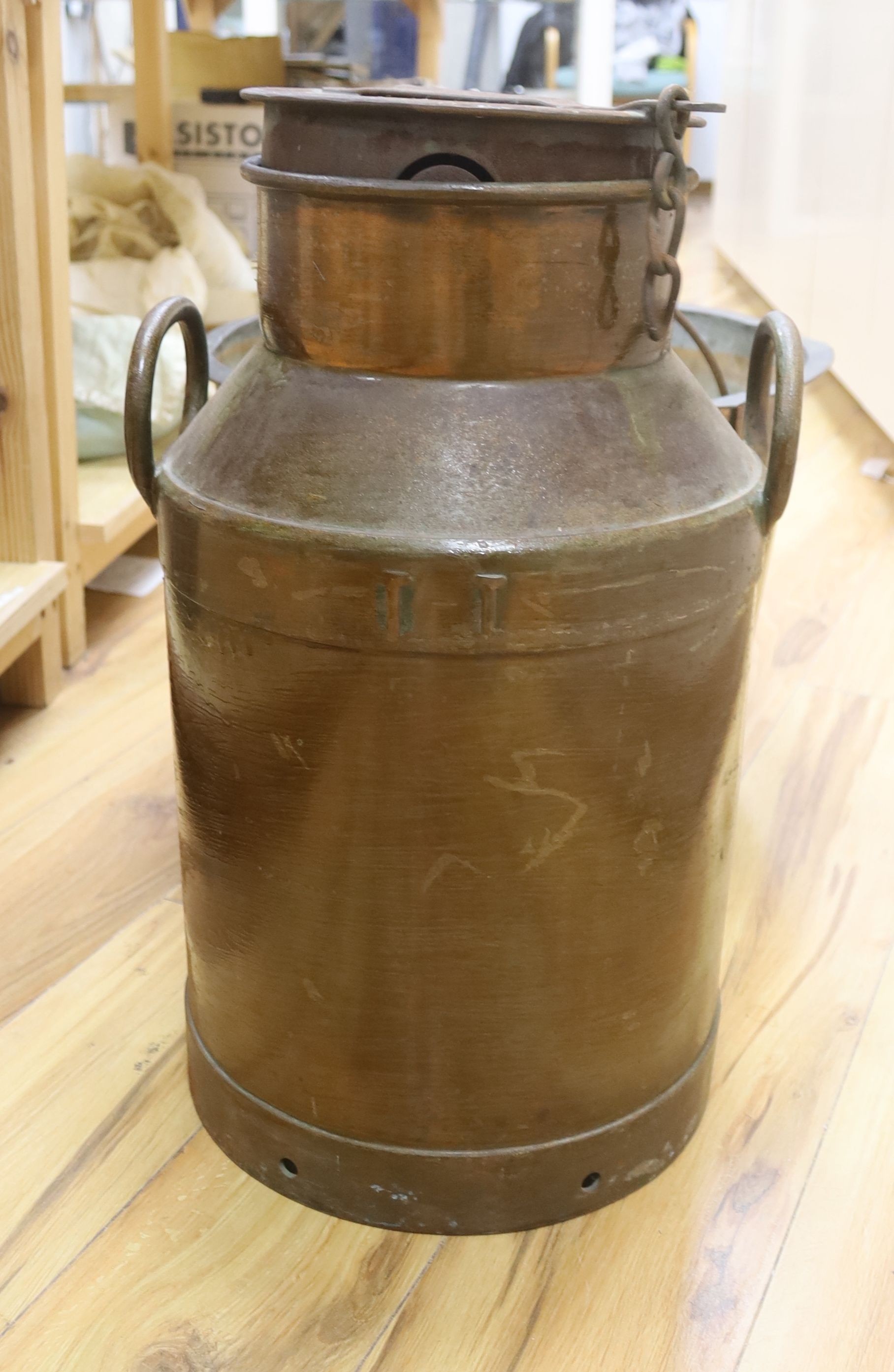 A copper pan and a milk churn, height 53cm